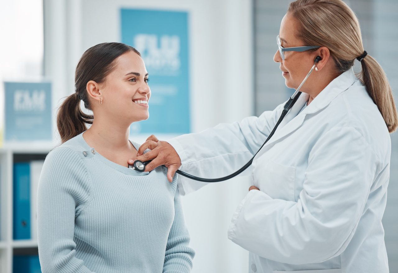 shot of a doctor examining a patient with a stethoscope during a consultation in a clinic.jpg